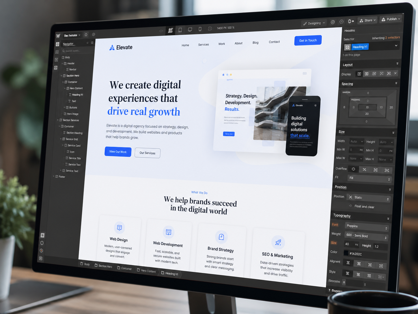 Elevate digital agency website shown on large monitor in design tool
